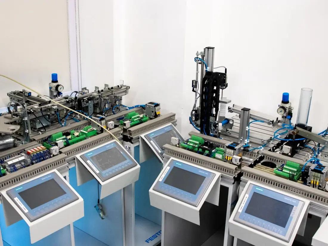 Operator panels wired to programmable logic controllers on an industrial automation rig